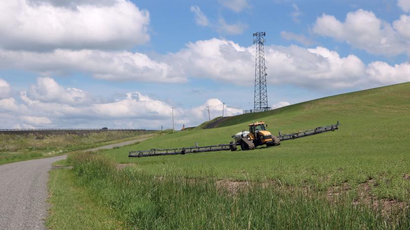 To provide cell phone services in rural areas between larger towns telecommunication companies install towers on hilltops or high ridges in rural areas. This tower is in rural Whitman County Washington adjacent to where a farmer is growing a crop. (Photo by: Don and Melinda Crawford/UCG/Universal Images Group via Getty Images)