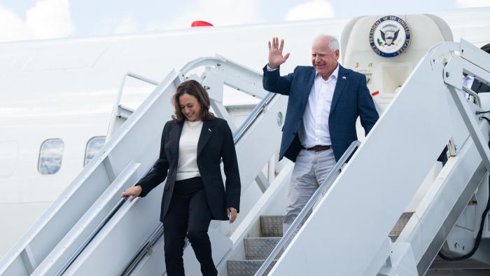 (L-R) US Vice President and Democratic presidential candidate Kamala Harris and her running mate Minnesota Governor Tim Walz step off Air Force Two upon arrival at Savannah/Hilton Head International Airport in Savannah, Georgia, August 28, 2024, as they travel for a 2-day campaign bus tour. (Photo by SAUL LOEB / AFP) (Photo by SAUL LOEB/AFP via Getty Images)