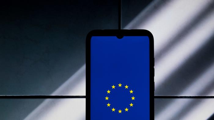 The European Union (EU) flag logo is being displayed on a smartphone screen in Athens, Greece, on January 19, 2024. (Photo by Nikolas Kokovlis/NurPhoto via Getty Images)