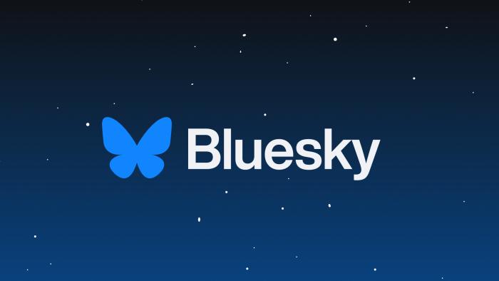 The Bluesky logo on a graphic of a night sky