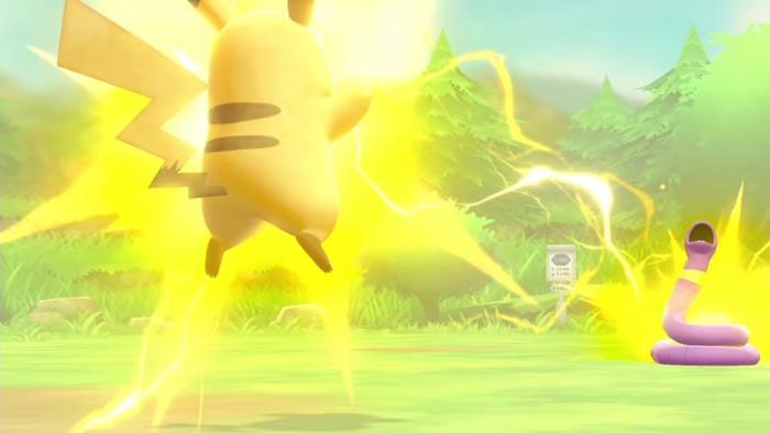 Pikachu is shown hovering off the ground and surrounded by electricity as a bolt hits the snake Pokemon Ekans in a still from Let' Go Pikachu